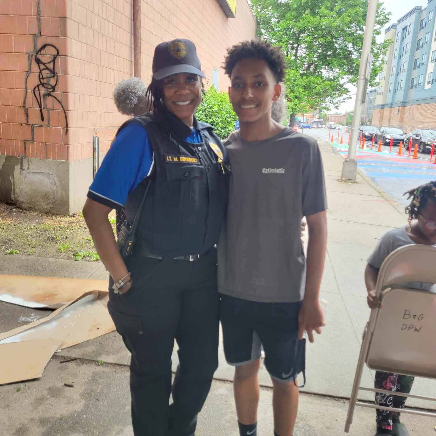 East Orange police lieutenant with a young volunteer