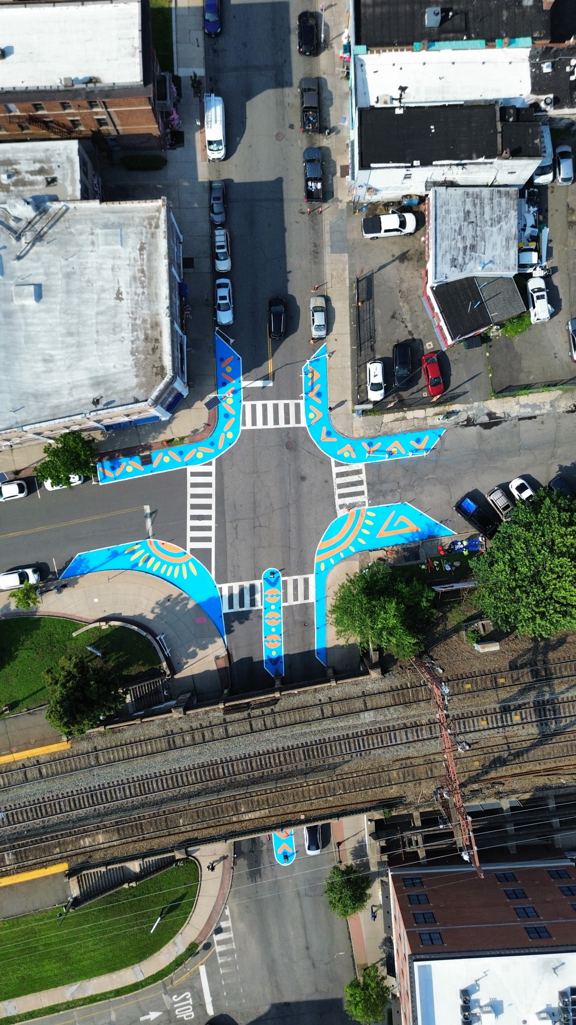 Aerial view of asphalt art intersection mural at S. Essex Ave., Orange