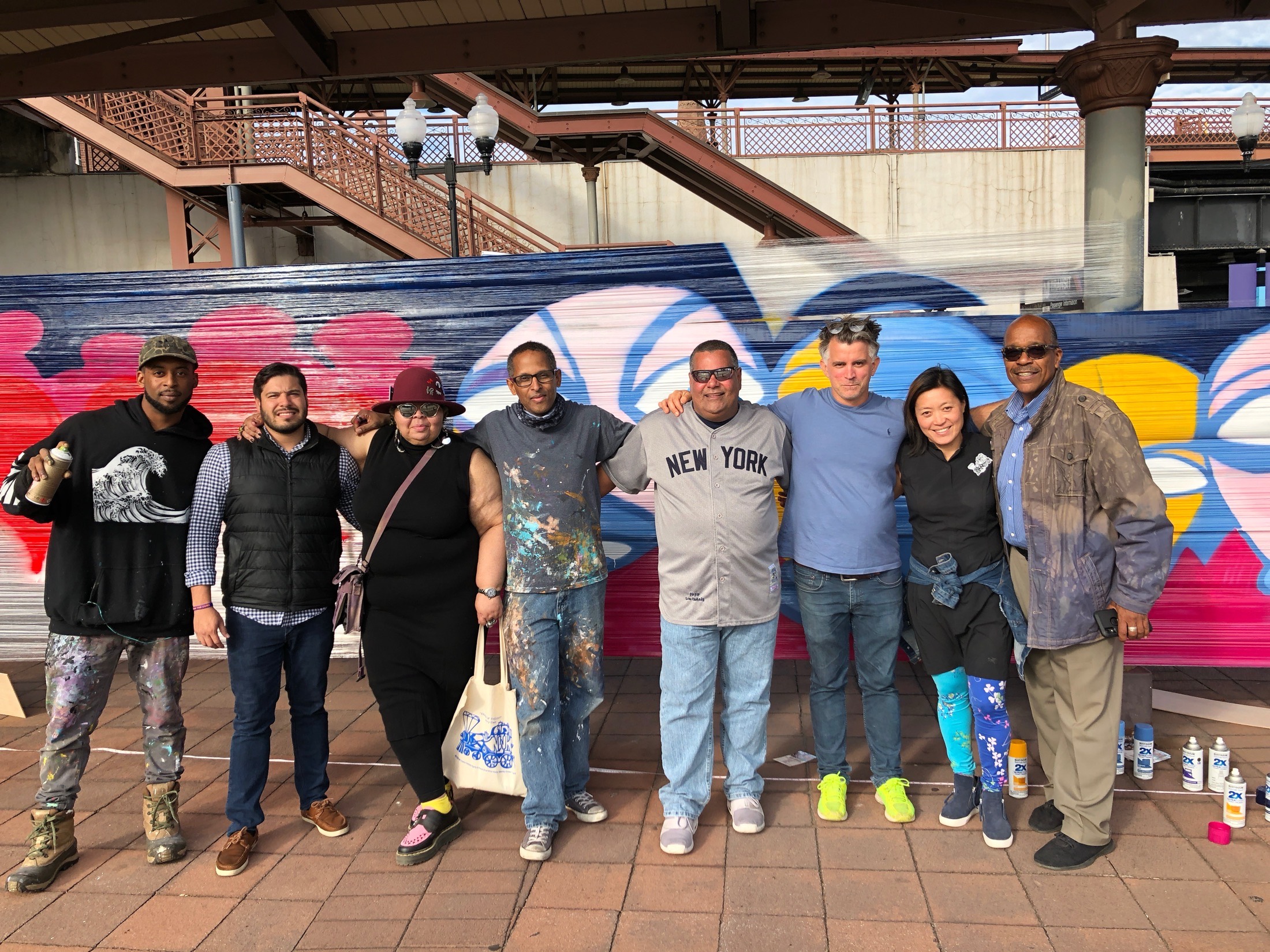 Project team and partners in front of the completed mural