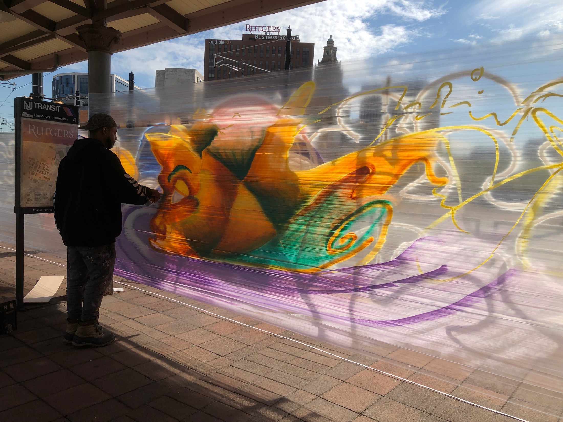 Mural painting in progress, motion blur