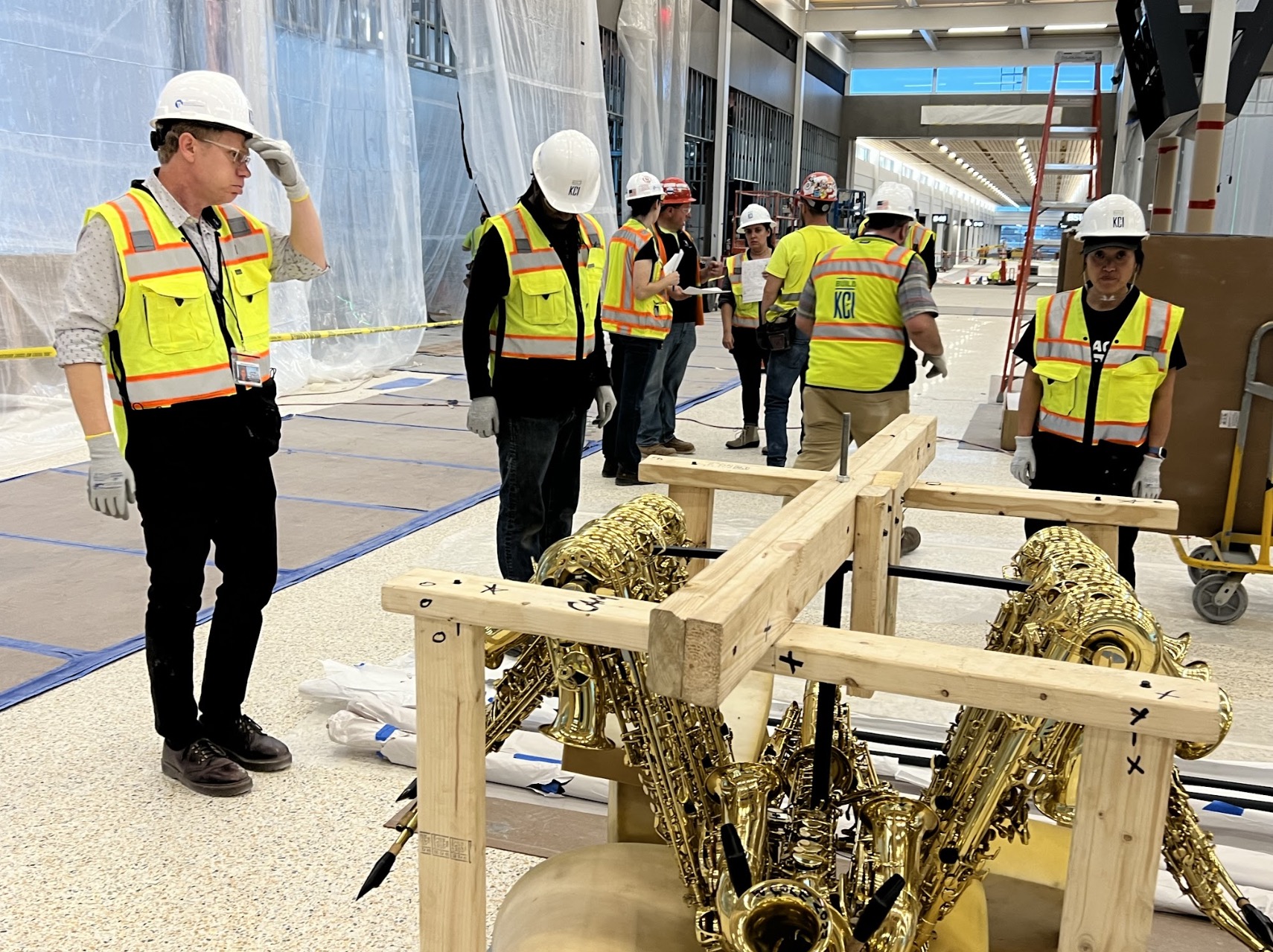 Project team inspecting crated sculptures