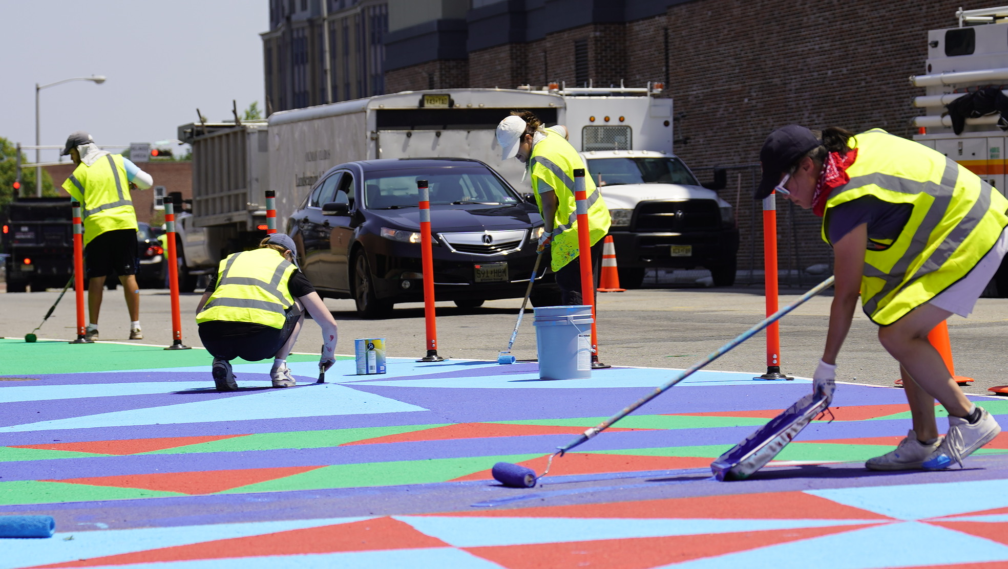 Crew painting a public art installation in progress